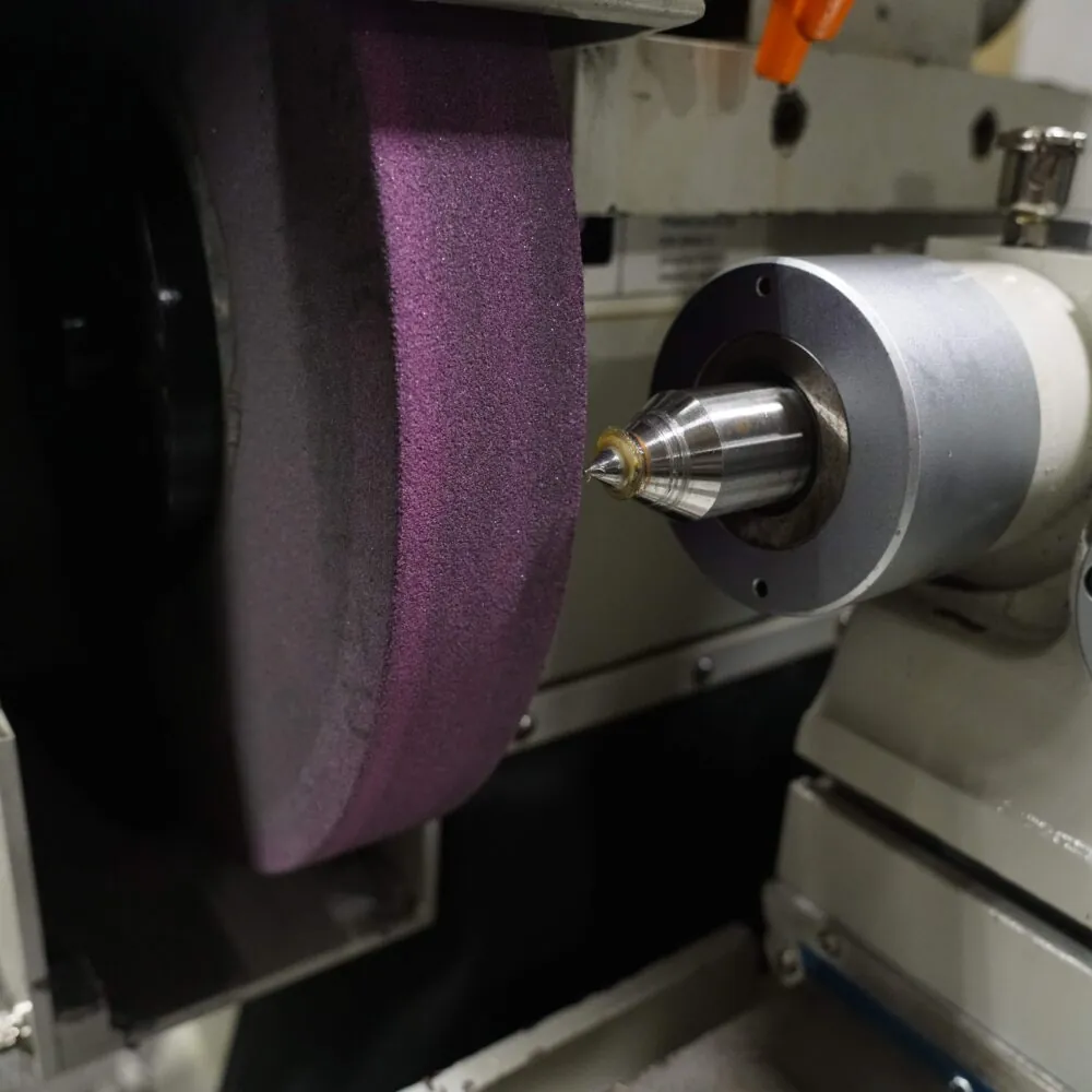 Precision grinder in use. Pride Tool uses advanced technology, specialized grinding media, wheels, and various precision grinding techniques to achieve the tolerances and surface finish your metal parts require. We do not shortcut our precision grinding processes and can do zero tolerances from rough to mirror finishes.